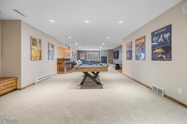 rec room featuring visible vents, carpet, and a baseboard radiator