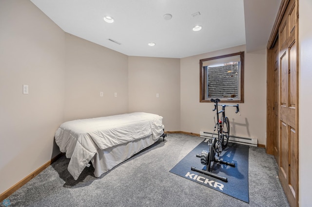 carpeted bedroom featuring recessed lighting, baseboards, a baseboard heating unit, and visible vents