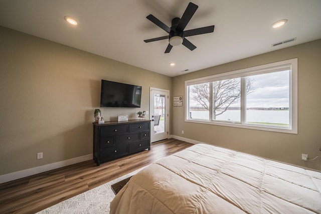 17292 Boyer Lake Rd, Lake Park, MN 56554 - bedroom with ceiling fan, access to exterior, baseboards, wood finished floors, and visible vents