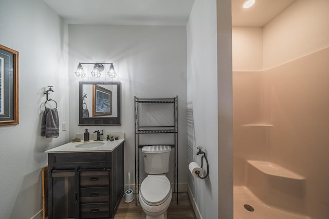 17292 Boyer Lake Rd, Lake Park, MN 56554 - bathroom featuring vanity, baseboards, wood finished floors, and a shower