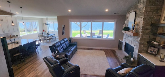 17292 Boyer Lake Rd, Lake Park, MN 56554 - living area featuring recessed lighting, wood finished floors, a wealth of natural light, and a fireplace