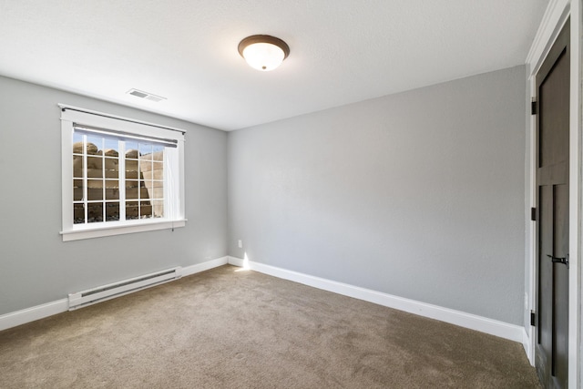 carpeted spare room featuring visible vents, baseboards, and baseboard heating