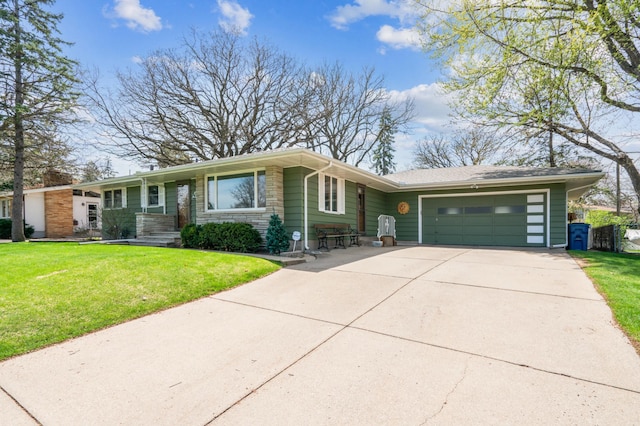 ranch-style home featuring a garage, concrete driveway, a front lawn, and stone siding
