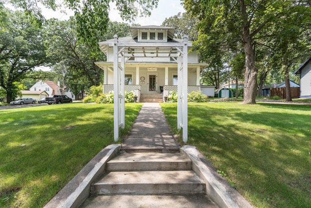 view of front facade featuring a porch and a front lawn