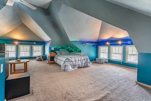 carpeted bedroom featuring multiple windows and lofted ceiling