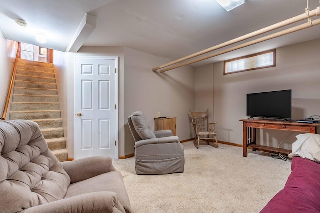 living room with stairs, baseboards, a healthy amount of sunlight, and carpet