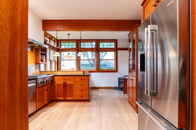 1043 Lincoln Ave, Saint Paul, MN 55105 - kitchen featuring stainless steel appliances, light wood-type flooring, brown cabinetry, a wood stove, and beam ceiling