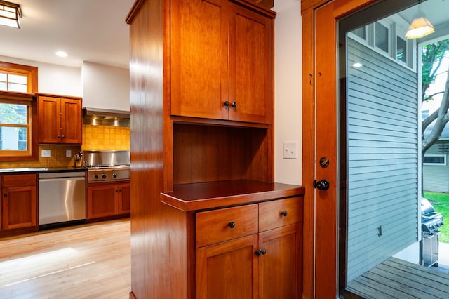 1043 Lincoln Ave, Saint Paul, MN 55105 - kitchen with appliances with stainless steel finishes, brown cabinetry, dark countertops, light wood-style flooring, and recessed lighting