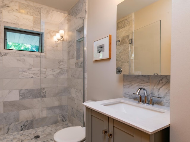 1043 Lincoln Ave, Saint Paul, MN 55105 - bathroom with vanity, a tile shower, toilet, and tasteful backsplash