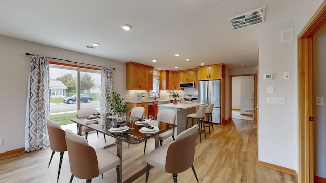 400 Alfred Ct SW, Eyota, MN 55934 - dining area with baseboards, light wood-style flooring, and recessed lighting