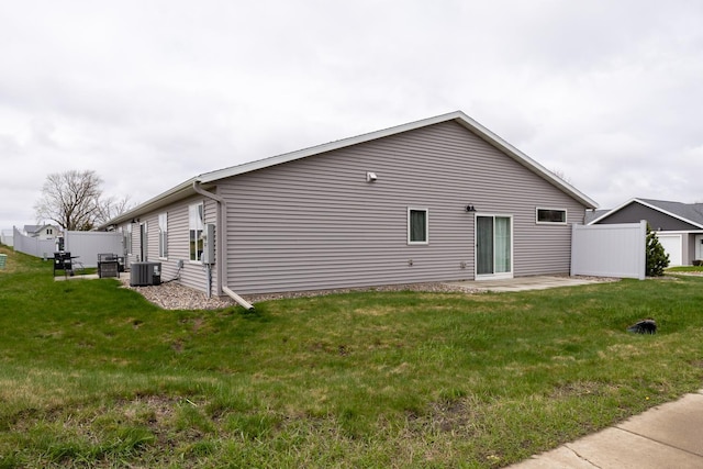 400 Alfred Ct SW, Eyota, MN 55934 - back of property with a yard, a patio, and central air condition unit