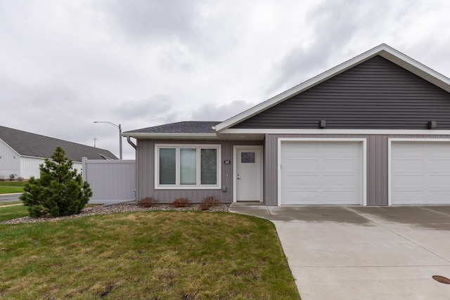 400 Alfred Ct SW, Eyota, MN 55934 - single story home with concrete driveway, a front lawn, and board and batten siding