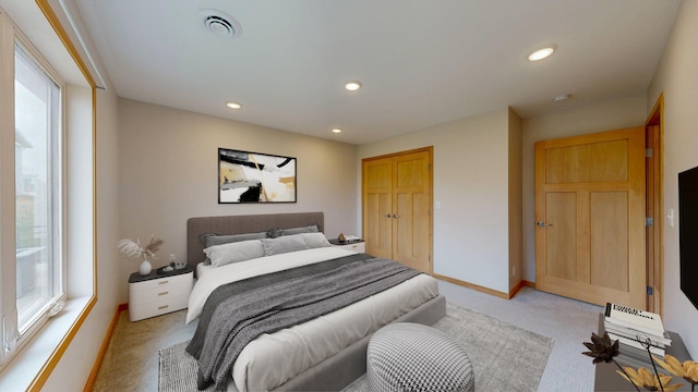 400 Alfred Ct SW, Eyota, MN 55934 - bedroom with light carpet, multiple windows, recessed lighting, and baseboards