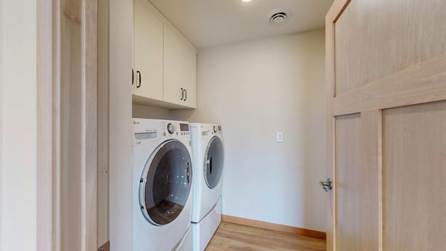 400 Alfred Ct SW, Eyota, MN 55934 - laundry area with separate washer and dryer, light wood-type flooring, cabinet space, and baseboards