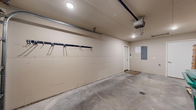 400 Alfred Ct SW, Eyota, MN 55934 - garage featuring electric panel, a garage door opener, and recessed lighting