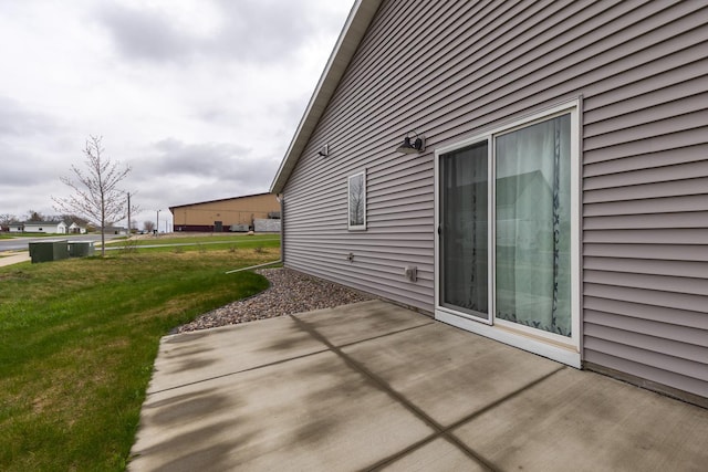 400 Alfred Ct SW, Eyota, MN 55934 - view of side of property with a patio area and a lawn