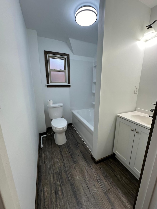 15 1st St SE, Melrose, MN 56352 - bathroom featuring toilet, wood finished floors, a tub to relax in, and vanity