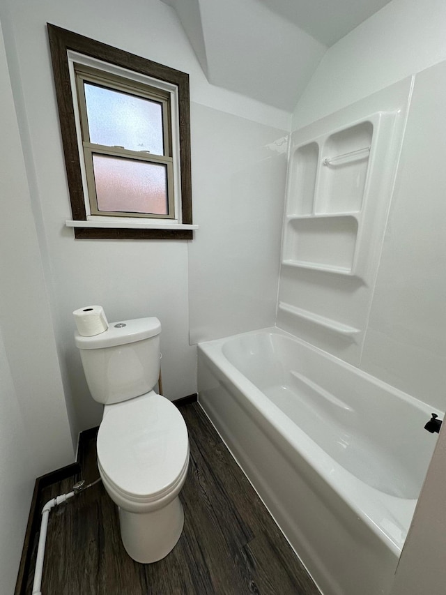 15 1st St SE, Melrose, MN 56352 - full bath featuring toilet, baseboards, wood finished floors, and lofted ceiling