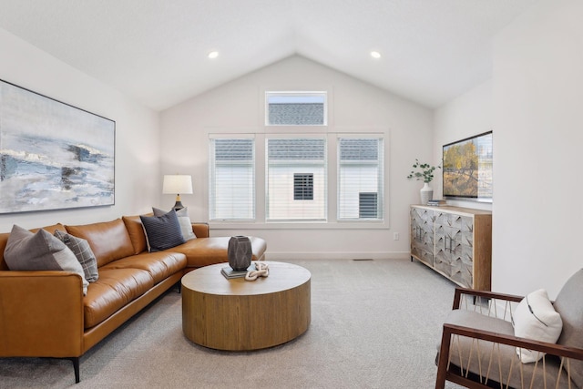 carpeted living area featuring recessed lighting, baseboards, and lofted ceiling