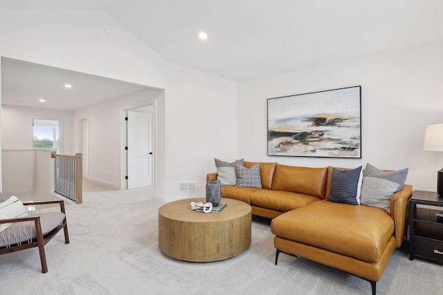 living area with recessed lighting, lofted ceiling, visible vents, and light carpet