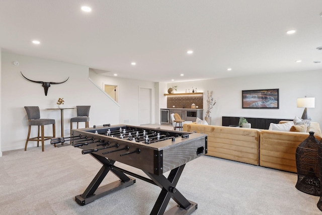 recreation room with recessed lighting and carpet