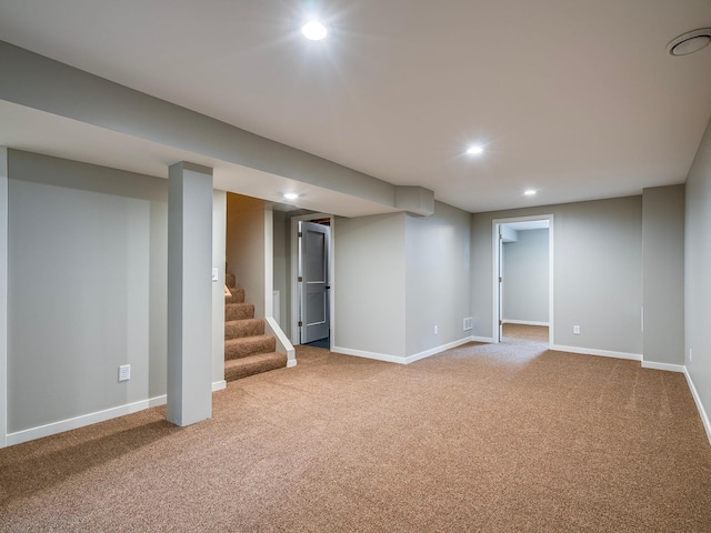 finished below grade area with carpet flooring, recessed lighting, and baseboards