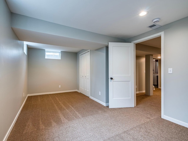 below grade area featuring carpet floors, recessed lighting, and baseboards