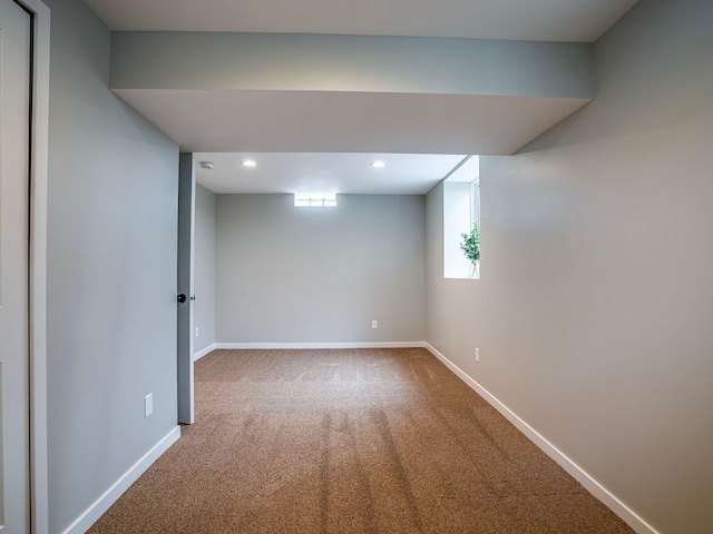 basement featuring carpet flooring, recessed lighting, and baseboards