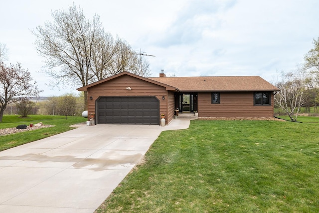ranch-style home with concrete driveway, a chimney, a front lawn, and a garage
