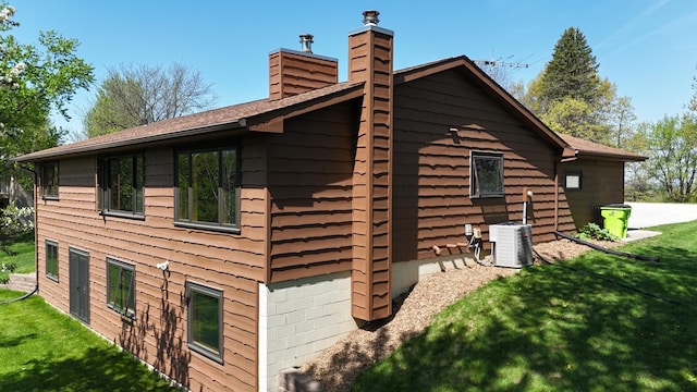46236 186th Avenue Ct, Zumbrota, MN 55992 - view of home's exterior with a chimney and a yard
