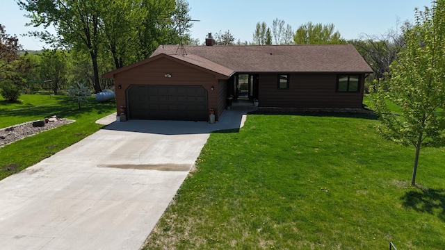 46236 186th Avenue Ct, Zumbrota, MN 55992 - view of front of house featuring a garage, driveway, a front lawn, and a chimney