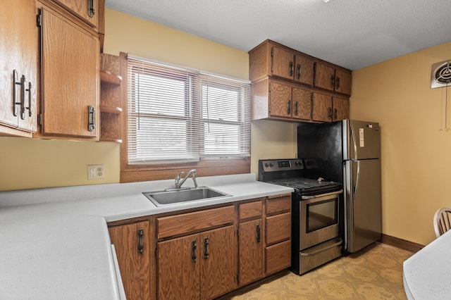 kitchen with a sink, appliances with stainless steel finishes, brown cabinets, and light countertops