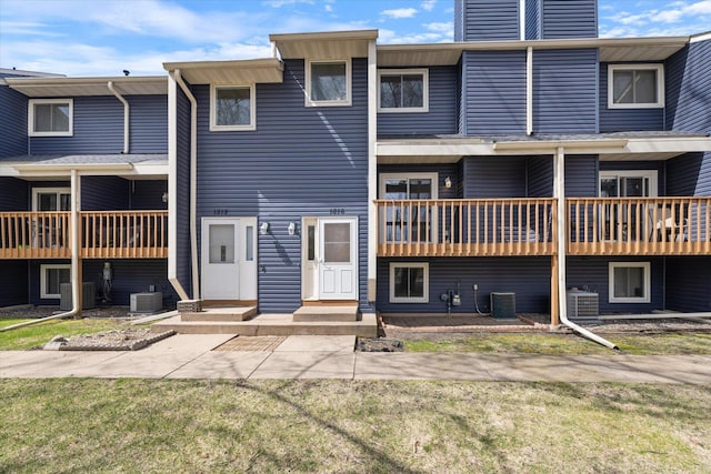 exterior space featuring a yard and cooling unit