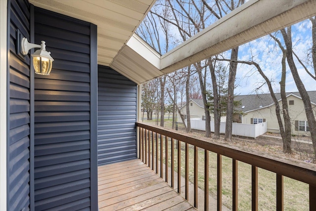 wooden terrace with a residential view