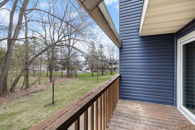 wooden terrace with a yard