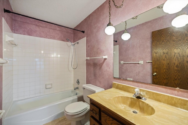 full bathroom with vanity, a textured ceiling, shower / bathing tub combination, and toilet