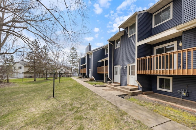 surrounding community featuring a lawn and a residential view