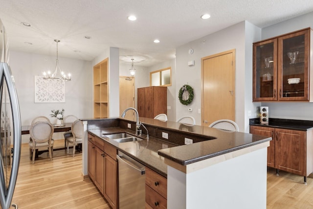 3640 Wooddale Ave S Unit 317, Saint Louis Park, MN 55416 - kitchen featuring a sink, stainless steel appliances, light wood-style flooring, a chandelier, and recessed lighting