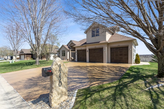 craftsman-style home with a shingled roof, an attached garage, stucco siding, a front yard, and driveway