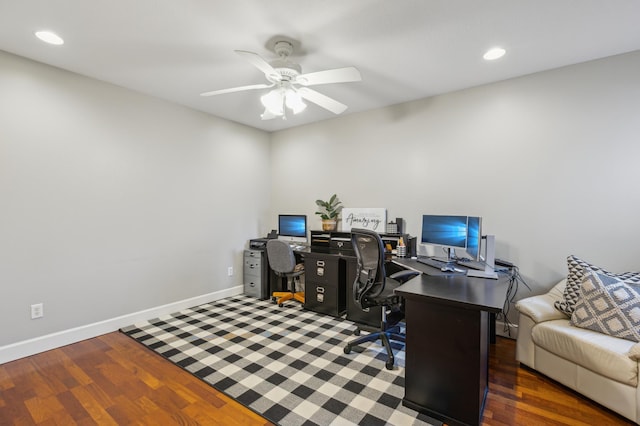 office area with baseboards, a ceiling fan, and wood finished floors