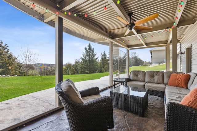 view of patio with an outdoor living space and a ceiling fan