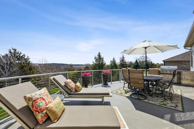 view of patio / terrace featuring a balcony, outdoor dining space, and a grill