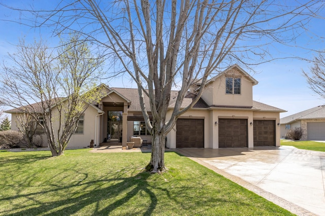 view of front of property with a garage, driveway, a front lawn, and stucco siding