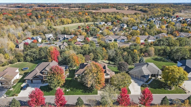 birds eye view of property with a residential view