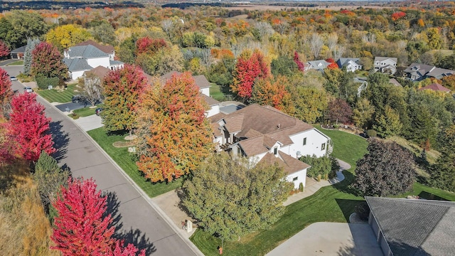 birds eye view of property with a residential view and a forest view