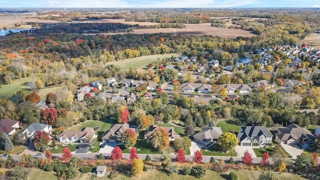 aerial view with a wooded view and a residential view