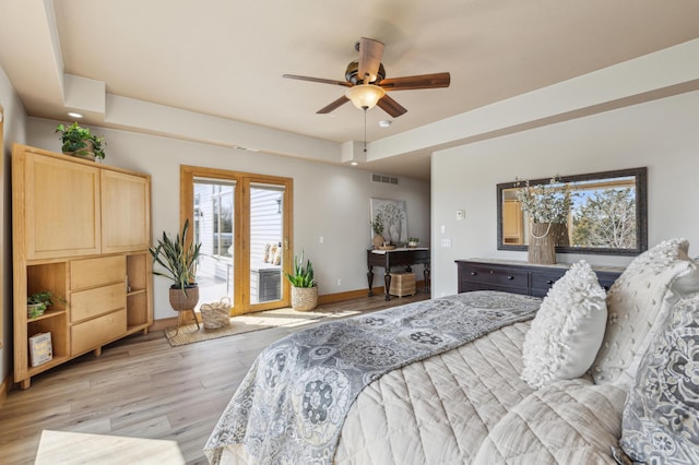2250 Lancaster Ave NE, Saint Michael, MN 55376 - bedroom featuring access to exterior, light wood-style floors, a tray ceiling, ceiling fan, and recessed lighting