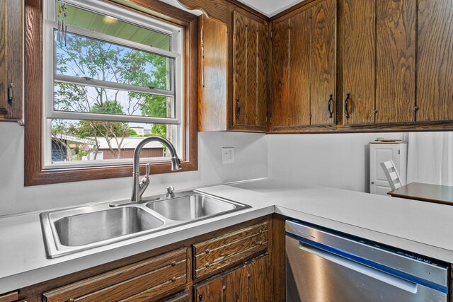 216 Richard Ave SE, Isanti, MN 55040 - kitchen featuring stainless steel dishwasher, a sink, and light countertops