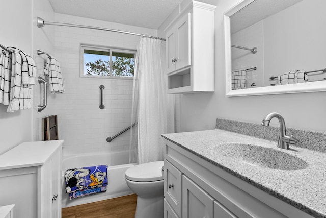 216 Richard Ave SE, Isanti, MN 55040 - full bath with vanity, shower / bathtub combination with curtain, toilet, wood finished floors, and a textured ceiling