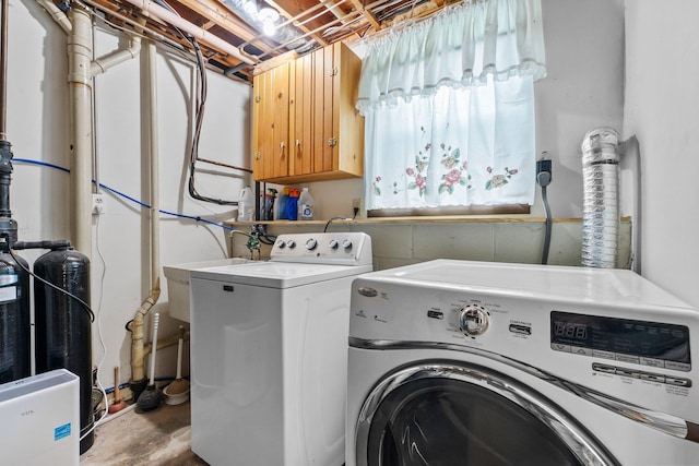 216 Richard Ave SE, Isanti, MN 55040 - washroom featuring washing machine and clothes dryer and cabinet space